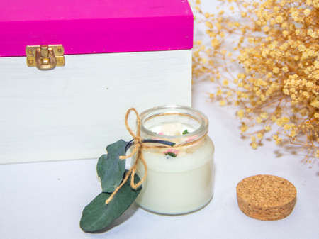 scented candles in glass jar with decorative elementsの写真素材