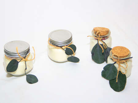 scented candles in glass jar with decorative elementsの写真素材