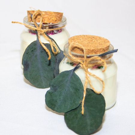 scented candles in glass jar with decorative elementsの写真素材
