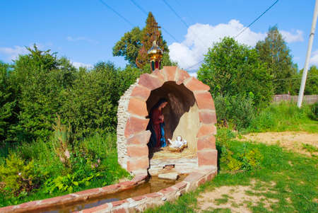 Grotto of the Saint maiden Maria with the baby and a spring with holy waterの写真素材