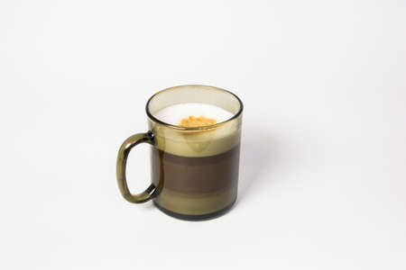 Puff coffee of Latte Macchiato in a black mugの写真素材