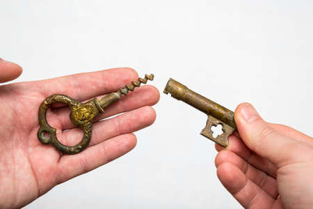 Vintage bronze key with a built-in corkscrewの写真素材