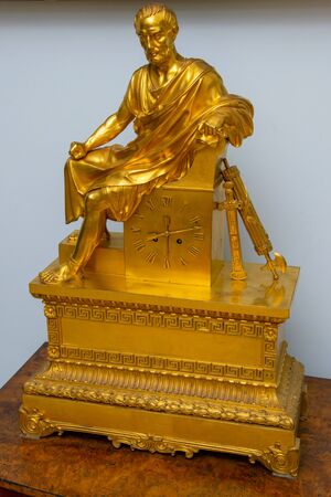 Old fireplace gilded watch with the Romanの写真素材