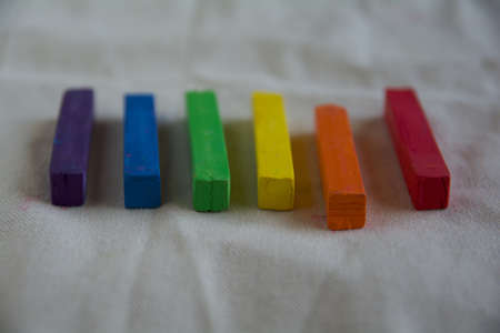 Blurred photo of the LGBT flag from the sticks of artistic pastel. Will serve as the background.の写真素材