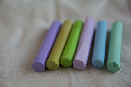 Photo with a group of sticks of artistic pastels with a predominance of green shades of pastels. Suitable for background.の写真素材