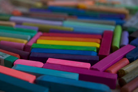Blurred photo of the LGBT flag from the sticks of artistic pastel. Will serve as the background.の写真素材