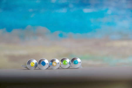 Tubes close-up with bright multi-colored watercolors blue, yellow, green shades. Good background for art publications.の写真素材
