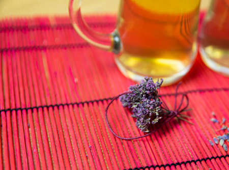 Herbal tea with oregano in glass glasses. A bouquet of dried oregano.の写真素材