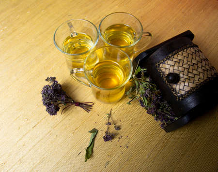 Herbal tea with oregano in glass glasses. A bouquet of dried oregano.の写真素材