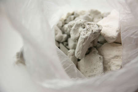 Slices of edible chalk and clay in a plastic bag, sorbentsの写真素材