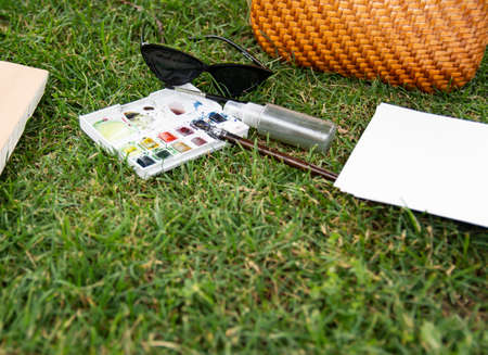Summer plein air in the park on a green lawn