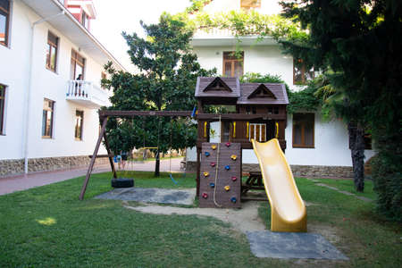 A colorful playground in the yard in the park.の写真素材