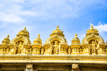 The portrait view of a structure on the top of a temple with blue sky backgroundの写真素材
