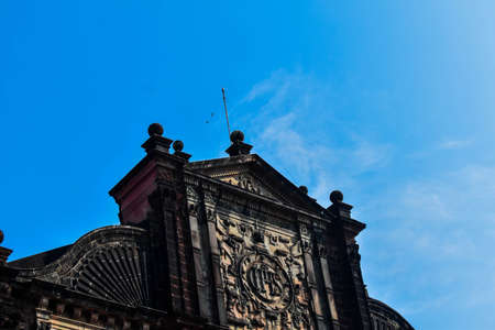 Basilica of bom jesus church in goa taken from lower angle with blue skyの写真素材