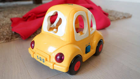 a yellow toy car and a carpetの写真素材