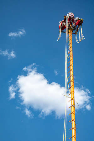 clowns hosting the Mexican rainforest, voladores, above the skyのeditorial素材