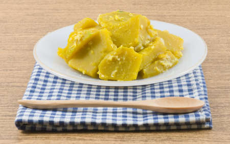 Thai Cuisine and Food, Close Up of Homemade Stir Fried Pumpkin with Egg on A White Plate.の写真素材