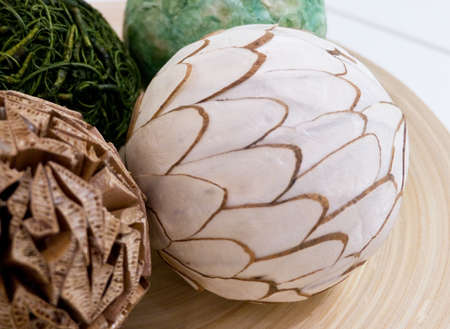 Home Decor, Colorful Vintage Paper Balls on A Wooden Tray Used for Home Decorating. Selective Focus on White Ball.の写真素材