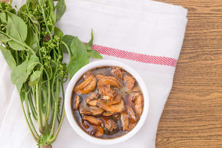 Thai Cuisine and Food, Top View of Fresh Margosa or Neem Leaves and Blossom Served with Sweet Sauce.の写真素材