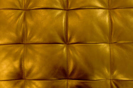Background Pattern, Closed up of Abstract Texture of Golden Leather Sofa or Upholstery Background.の写真素材