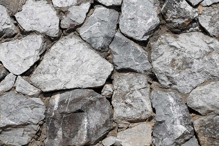 Background Pattern, The Horizontal Brown Asymmetrical Rock Wall Background or Texture.