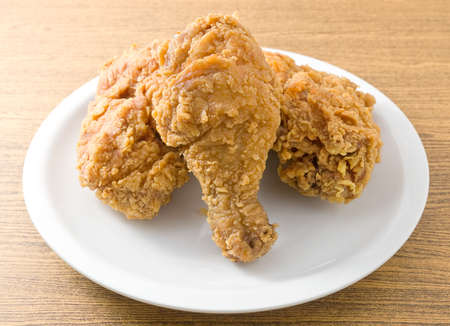 Cuisine and Food, Plate of Crispy Fried Chicken on Brown Wooden Table.の写真素材