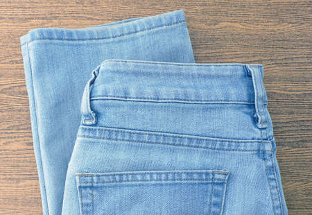 Fabric Texture, Close Up of Blue Denim Jean on Wooden Background.の写真素材