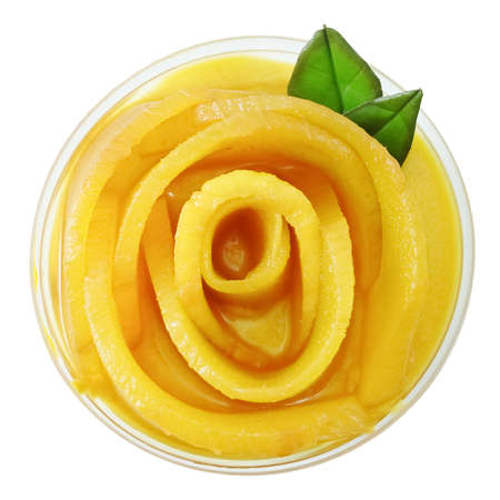 Top View of Mango Cheesecake Isolated on White Background, A Sweet Dessert Consisting of Cream Cheese, Biscuits Crust or Cookies Crust and Ripe Mango.の写真素材