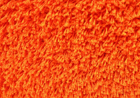 Fabric Texture, Close Up of Orange Plush Pattern Background with Copy Space for Text Decoration. Selective Focus.の写真素材