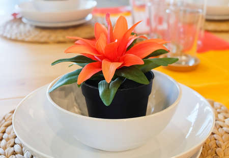 Beautiful Artificial Plant with Orange Blossom in Flowerpot for Home and Building Decoration.の写真素材