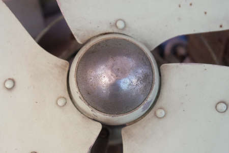 Close Up of Old Vintage Green Metal Electronic Fan Blade or Propeller Fan.の写真素材