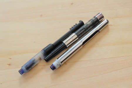 Business Accessory, Three Nibs of Traditional Vintage Fountain Pens on A Wooden Table.の写真素材