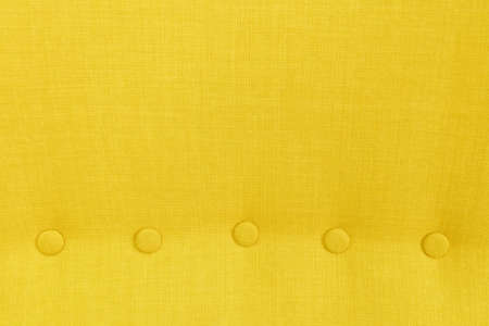 Fabric Texture, Close Up of Yellow Textile Pattern Background with Round Buttons.