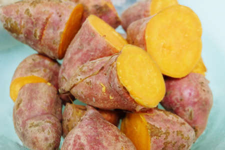 Vegetable and Fruit, of Close Up of Streamed Orange Sweet Potatoes High in Vitamin A, Vitamin C and Vitamin B6.の写真素材