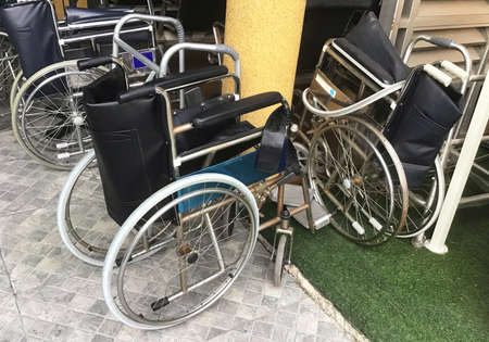 Empty Wheelchairs or Chair with Wheels Use By People Who Cannot Walk for Moving Around, Preparing to...