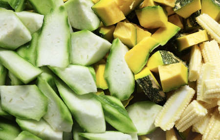 Vegetable, Closeup Raw Chopped Pumpkins, Angled Gourds or Sponge Gourds and Baby Corns.の写真素材
