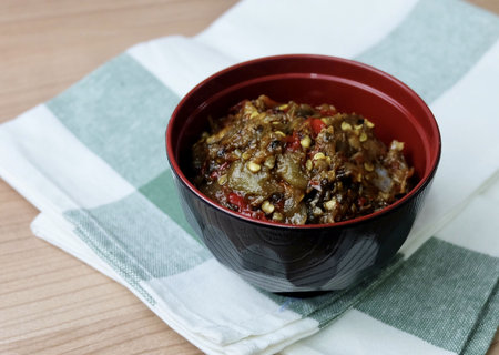 Thai Cuisine and Food, A Bowl of Nam Prik Num or Green Chili Paste Isolated on White Background. One of The Most Popular Dish in Thailand.の写真素材