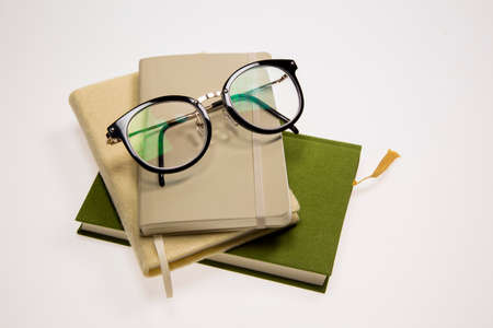 Books and a glassesの写真素材