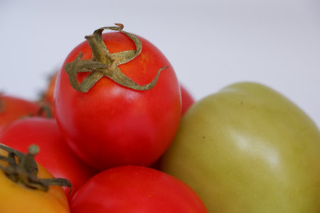 Tomatoes on a white background, close-up, selective focusの写真素材