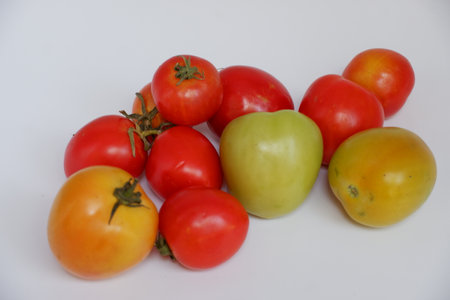 tomatoes on a white background, close-up, red and yellowの写真素材