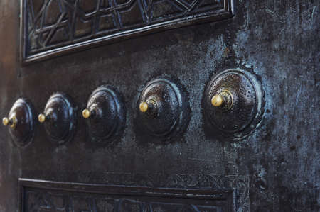 Decoration on mosque door  Round embossing weld on metal door  It is made of copper  Tips are yellow coloredの写真素材