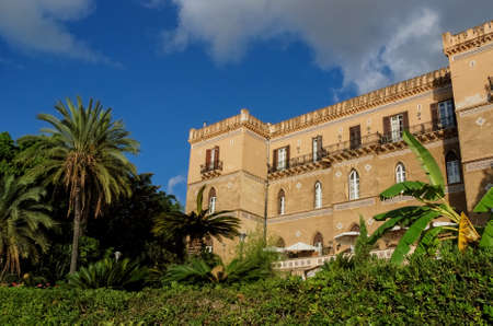Mediterranean vacation hotel amongst palm trees  Palermo, Sicily, Italy のeditorial素材
