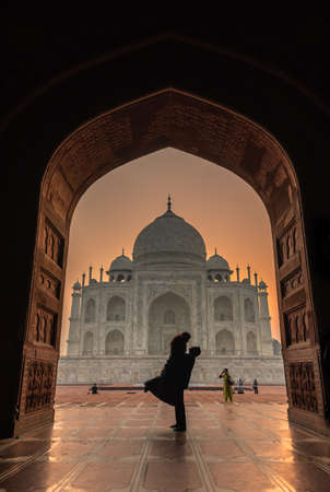 Agra,Utter Pradesh / India - October 13,2019. Silhouette of Couple in front of Taj Mahal .のeditorial素材