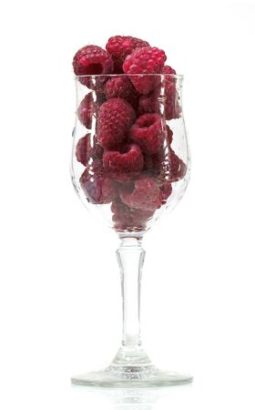 glass with raspberrys in a white background