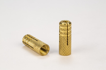 Metal bolts and screws on white background