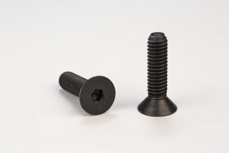 Metal bolts and screws on white backgroundの写真素材