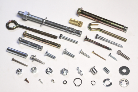 Metal bolts and screws on white backgroundの写真素材
