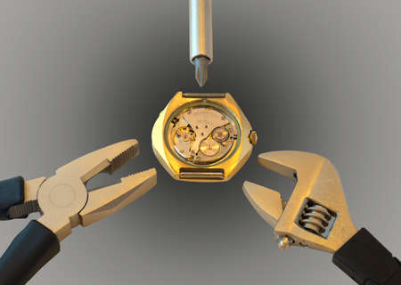 Dismantled watch between instruments on gray background