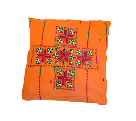 Orange pillow with pattern isolated on white backgroundの写真素材