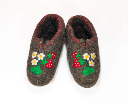 Felt shoes with pattern on white background